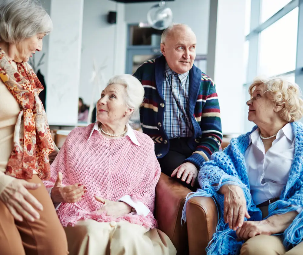Aged adults having conversation indoors Aged adults having conversation indoors